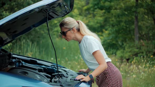 Popped Up Hood Woman Fix Car Problem. Pop Up Car Hood To Repair Damaged Auto Repair Service.