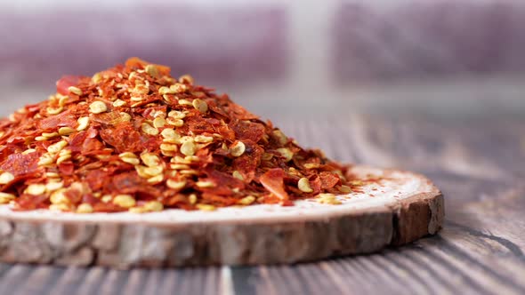 Top View of Chili Flakes on Wooden Board on Table