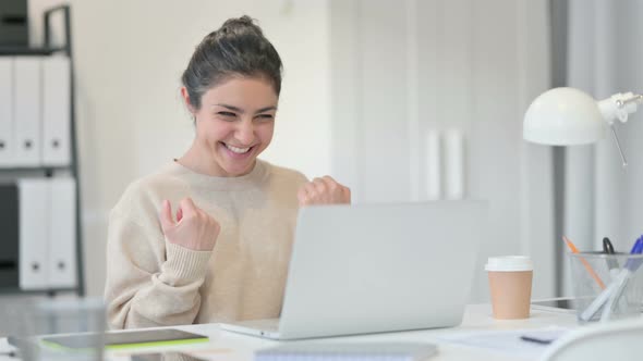 Indian Woman with Laptop Celebrating Success 