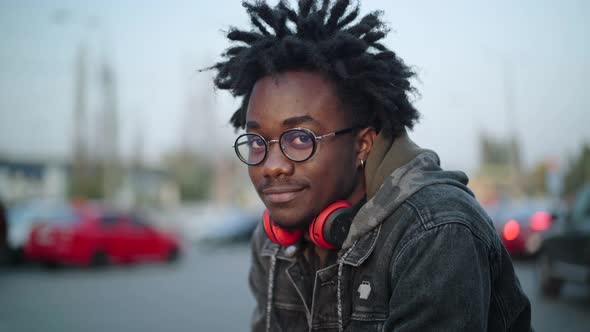 Closeup Portrait of Smiling Handsome African American Man in Eyeglasses Looking at Camera