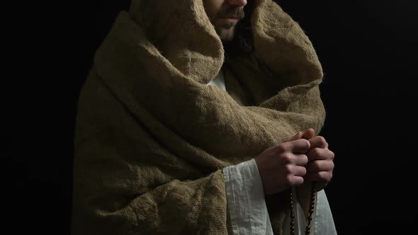 Jesus Christ in Robe Holding String of Beads and Praying to God, Saving Grace