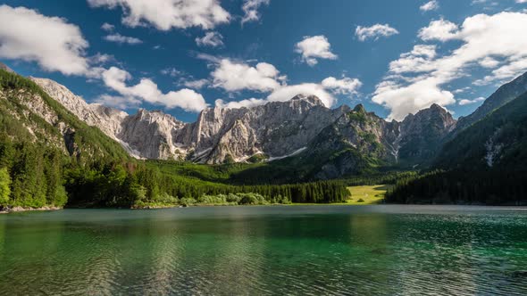 Alpine Italy. Landscape with Mountain Lake, Forest, Mountains and Clouds. Time Lapse, 