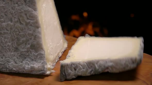 Pyramid Valencay Cheese Falls on a Wooden Board