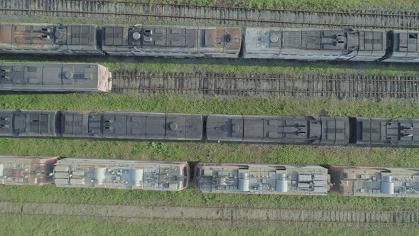 Aerial Top Down Shot of an Abandoned Rusty Locomotives and Old Railways