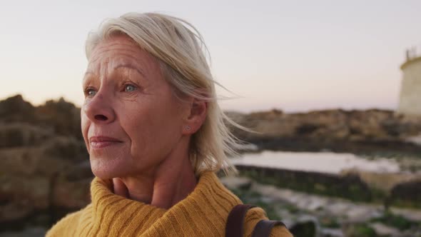 Side view of senior woman at beach