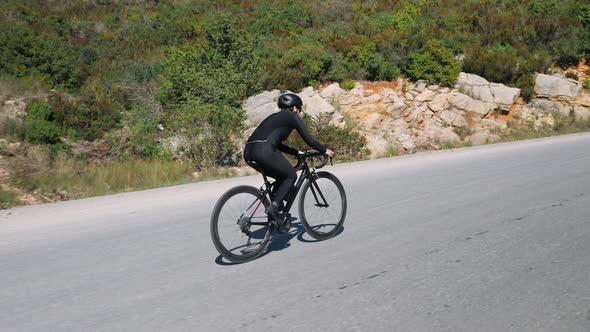 Cycling up the mountain on road bicycle