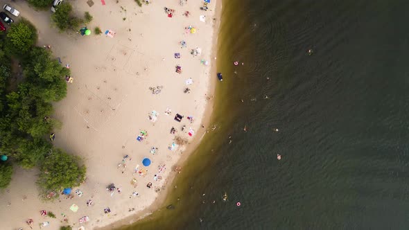 Aerial View From Drone on People Having a Rest on the River Bank in Summer