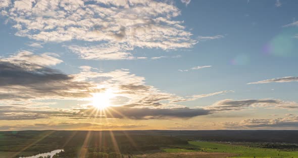 Beautiful View of the Wild Field During Sunset, Time Lapse, Clouds of Different Levels Move To the