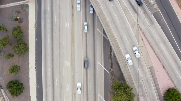 Los Angeles Motorway.  Aerial Overlook on the Roadbed and Cars Moving Along It