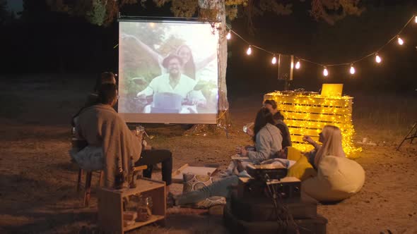 People Watching Movie At Open Air Cinema