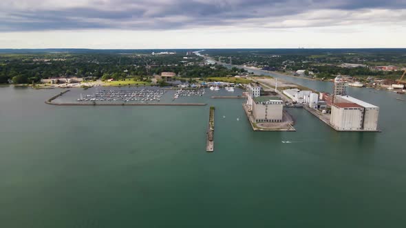 Aerial view of boats entering marina and port facilities on a beautiful green waters of Lake Erie. A