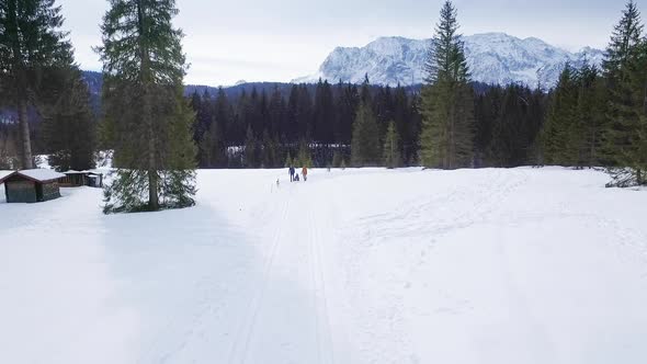 Happy family taking a winter walk with sibirian husky