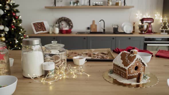 Zoom in video of little boy stealing gingerbread cookies from the table