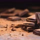 Broken dark chocolate bars on black background, stack of chocolate pieces - VideoHive Item for Sale