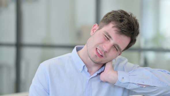 Portrait of Young Man Having Neck Pain