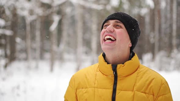 Close Up Portrait of Young Man Traveler. Happy Hiker, Climber Looking at the Top of Mountain in Slow