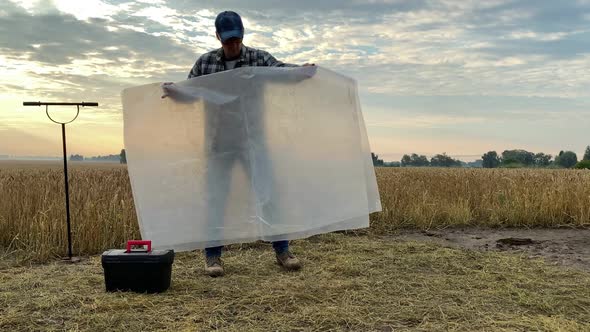 Agronomist Preparing for Fertility Analysis Soil Research at Dawn