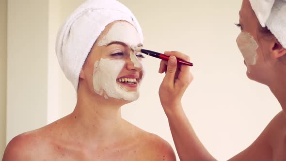 Beautiful Woman Having a Facial Treatment at Spa