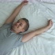 Young Man Falling on Bed at Home Relaxing and Smiling Slow Motion - VideoHive Item for Sale