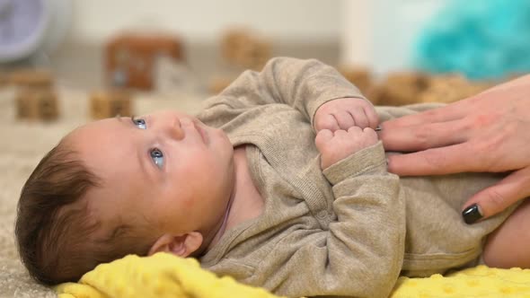 Lady Tickling and Massaging Kids Tummy, Playing With Charming Baby, Happiness