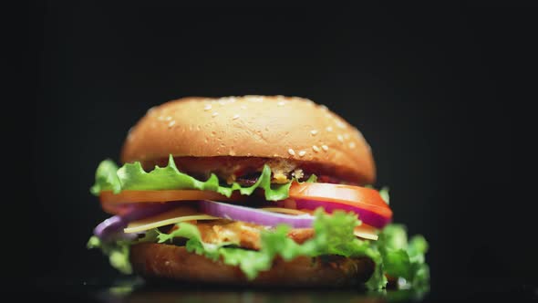 Big and Tasty Burger is Rotating on the Plate