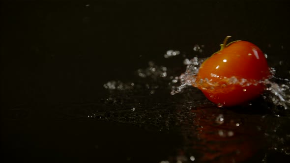 Tomato spinning on a wet surface, Ultra Slow Motion