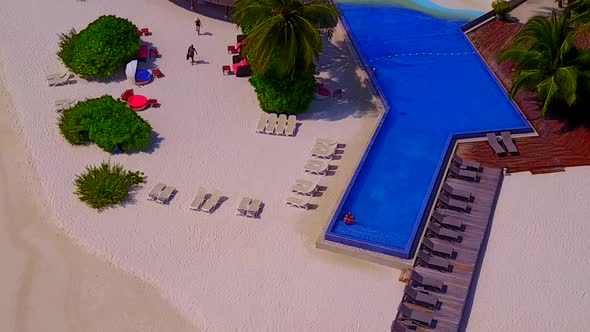 Aerial travel of marine resort beach by ocean with sand background