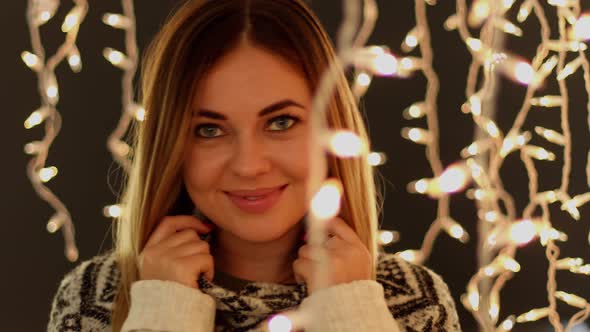 Cute Women in Front of Christmas Lights