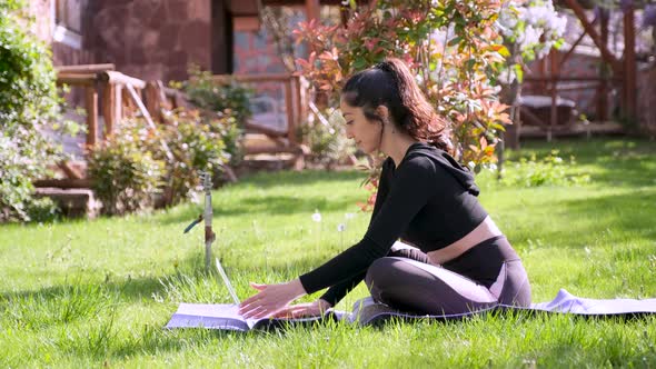 Woman Using Laptop Outdoors