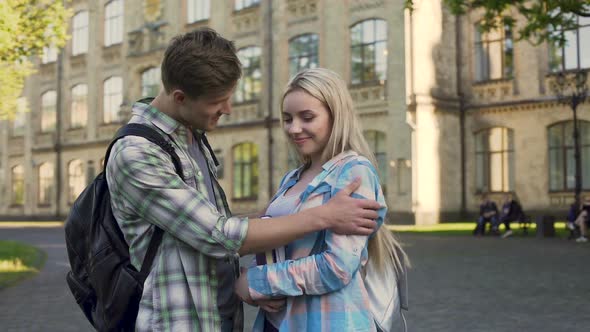 Handsome Young Man Flirting With Pretty Blonde Near College, Students, Meeting