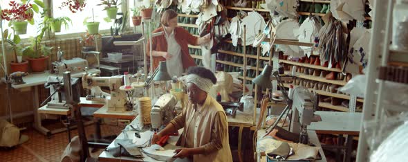 Multiethnic Women Working in Shoemaking Workshop