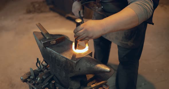 Blacksmith Makes a Hole in the Horseshoe