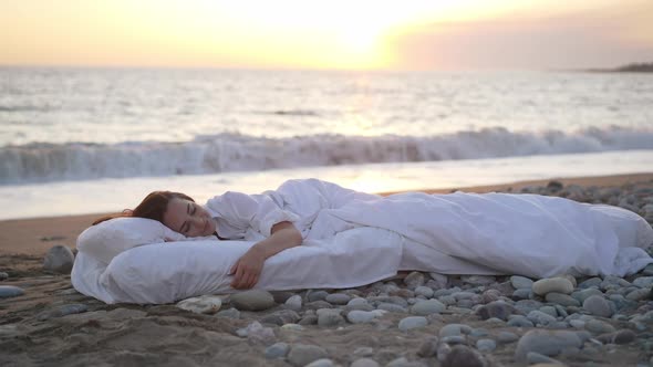 Wide Shot Portrait of Happy Relaxed Smiling Young Woman Lying in Cushioned Comfortable Bed with