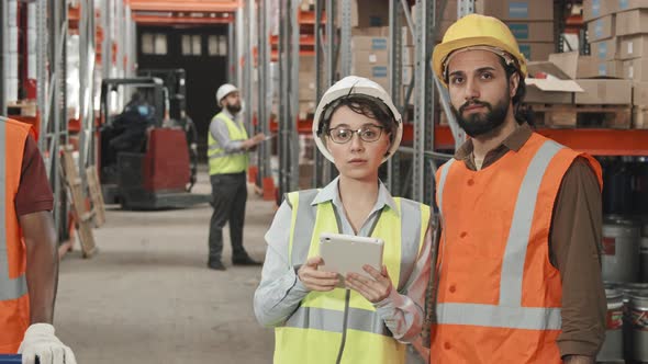 Man and Woman Posing in Warehouse