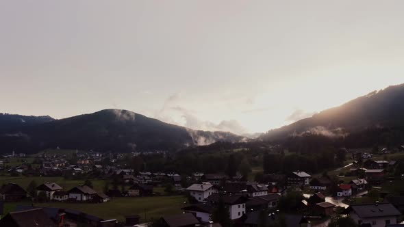 Panoramic View of a Picturesque Mountain Valley with a Village in a Lowland