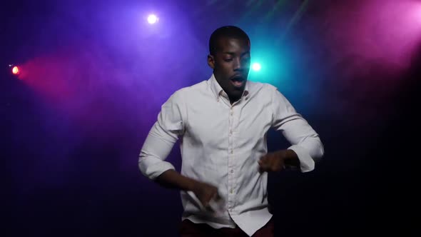 African American Man Dancing, Making Rhythmic Movements with His Hands