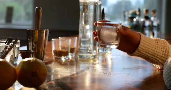 Female worker having gin in distillery factory 4k