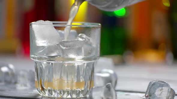 Orange Drink Pours Into Glass