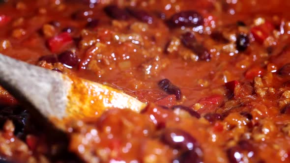 Cooking chili con carne in frying pan. 