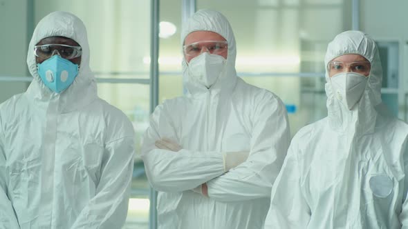 Portrait of Multiethnic Lab Workers in Protective Uniforms