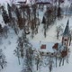 Aerial Top View of the Krimulda Evangelic Lutheran Church in Winter at Sunrise Latvia 4k Video - VideoHive Item for Sale
