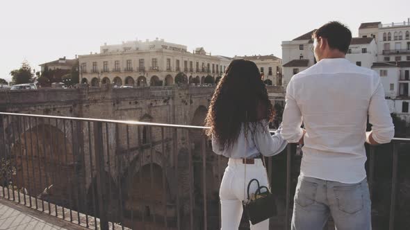 Young Tourist Couple Looking At Ronda