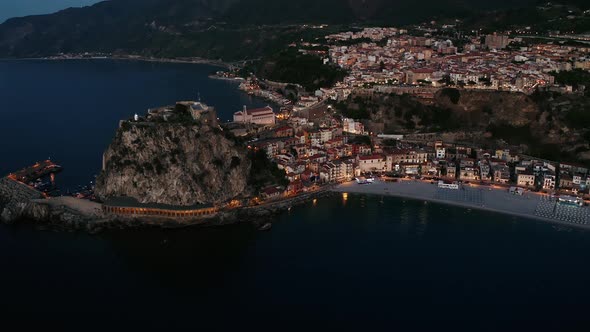 Aerial view of city of Scilla by night , Chianalea. Calabria Italy