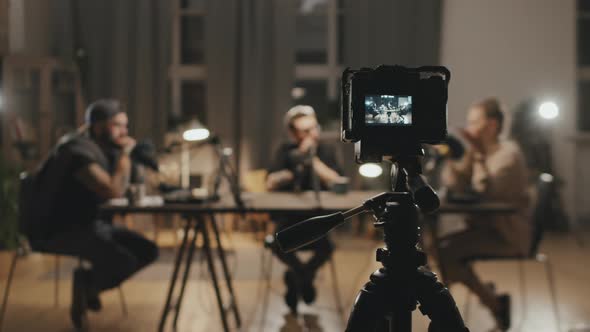 People Filming Podcast in Living Room