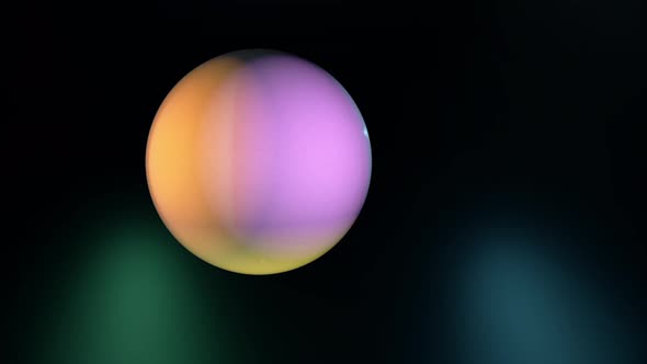 Animation of abstract blur colorful ball moving around on a black background