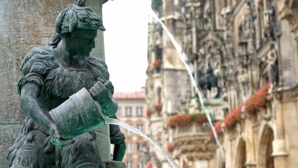 Locked Down Real Time Medium Shot of the Figure of a Boy on the Famous Fish Fountain on the