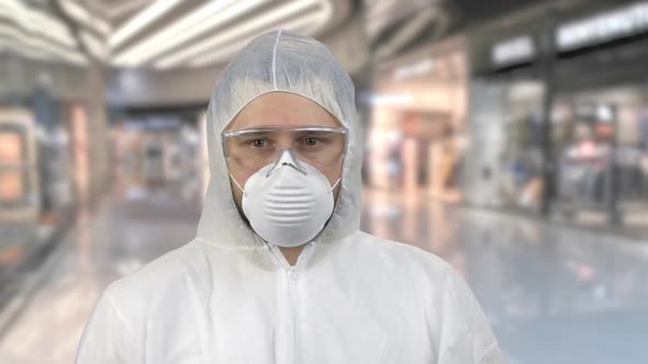 Portrait of Man in Special Protective Antiviral Clothing Looking Around