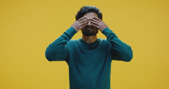 Young Man Covering Eyes