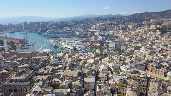 Aerial panoramic drone view of buildings and streets surrounding Port of Genoa,Italy. 4K video