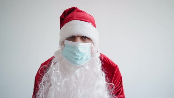 Santa Claus in Medical Mask Looks Camera